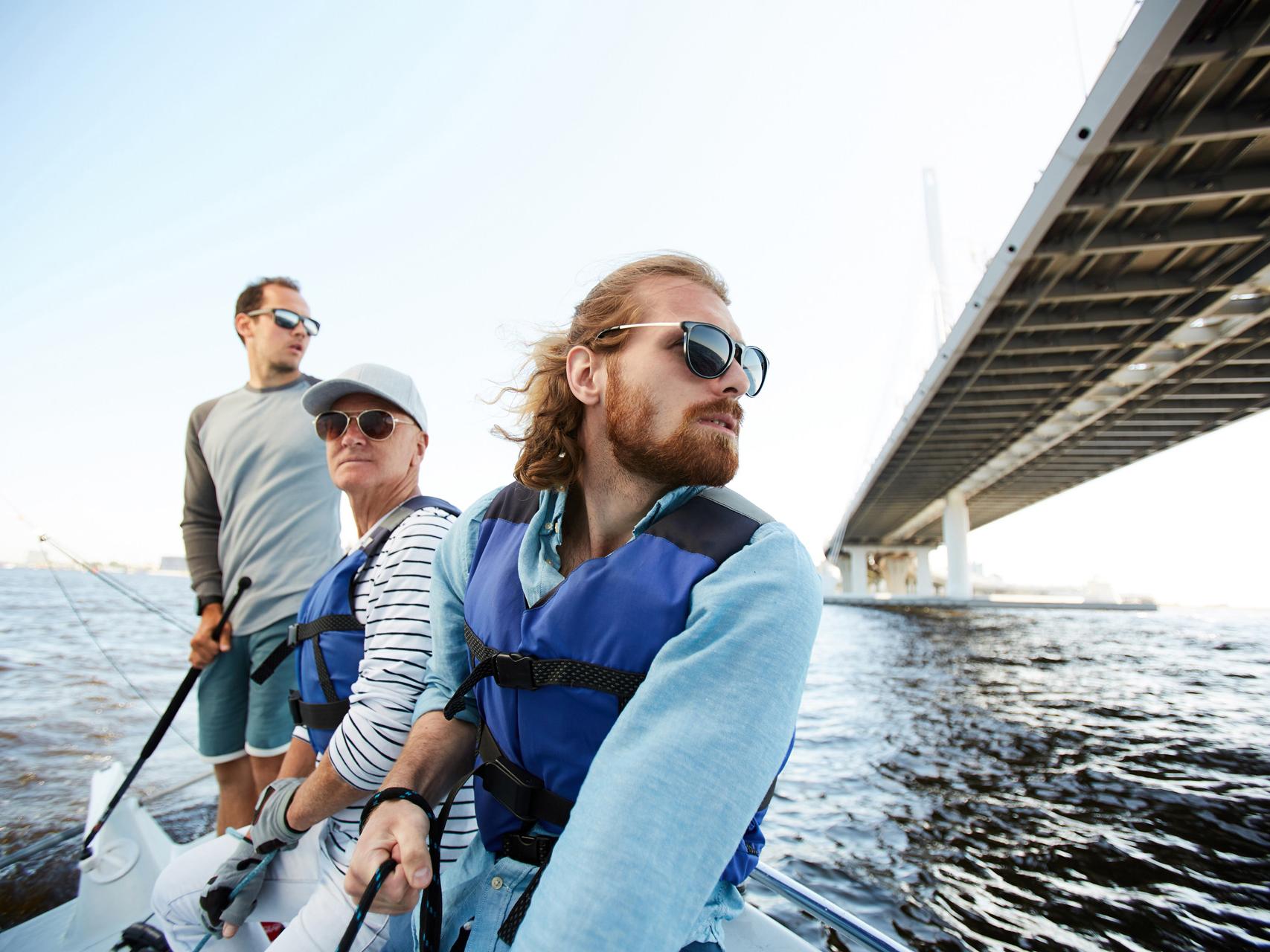 Men sailing yacht