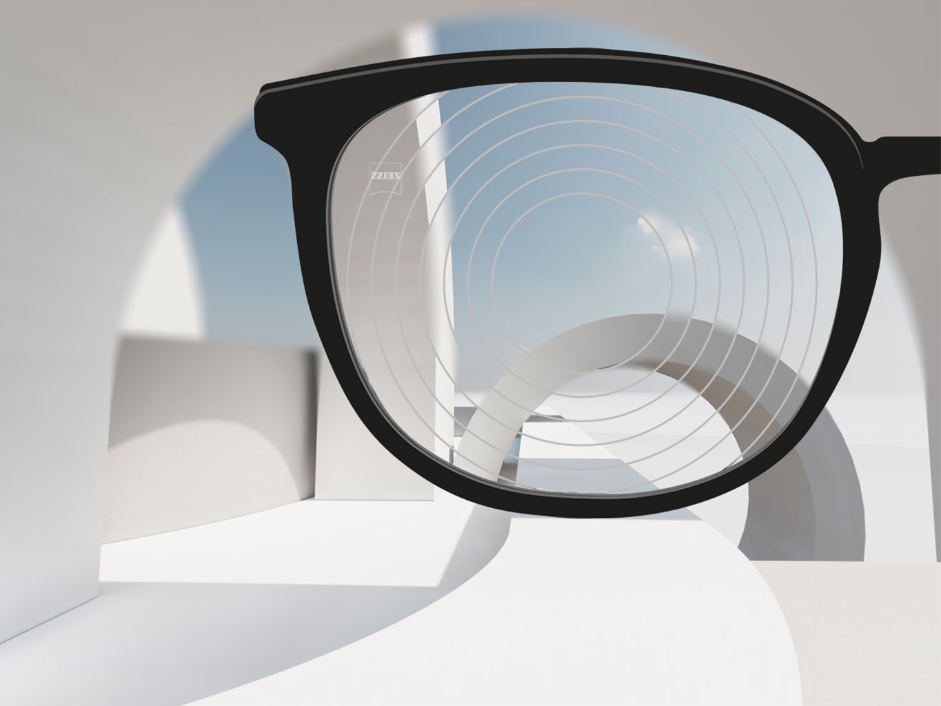 Une image rapprochée de verres de gestion de la myopie de ZEISS, avec une monture de lunettes et des cercles concentriques sur la surface des verres.